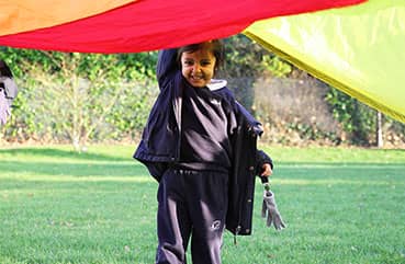 Girl playing parachute games