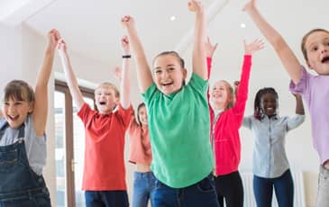 children dancing indoors