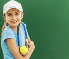 Girls holding tennis racket and ball